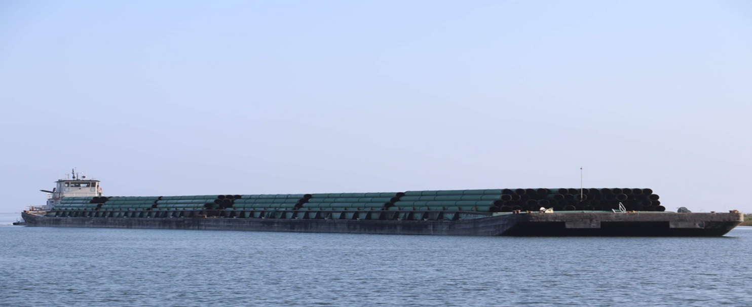 Loaded barge underway
